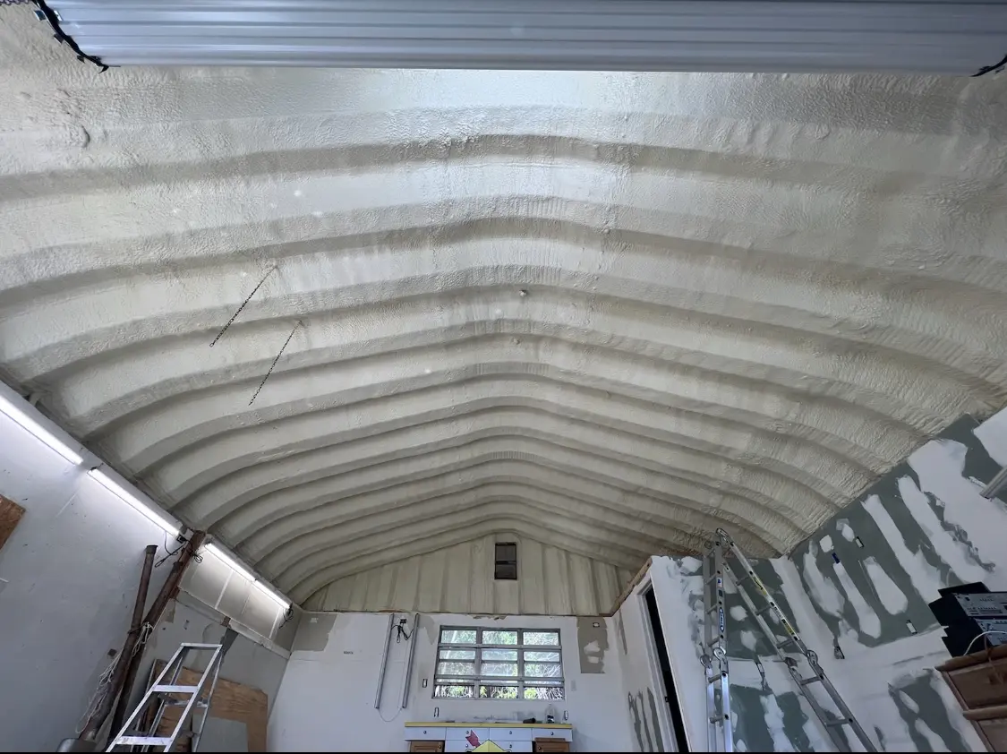 Spray polyurethane foam applied to the underside of a metal roof deck in Cedarburg